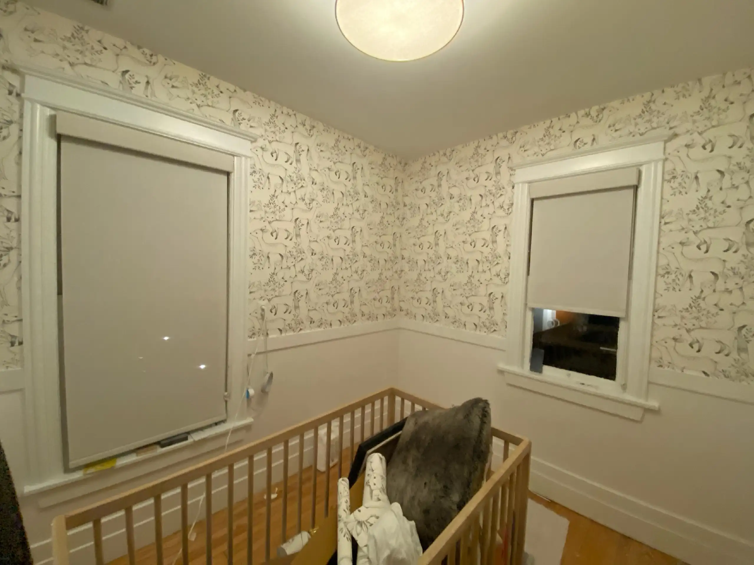Close view of a patterned wallpaper across a bright interior wall